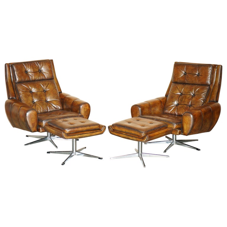 PAIR OF RESTORED MID CENTURY MODERN BROWN LEATHER SWIVEL ARMCHAIRS & FOOTSTOOLS