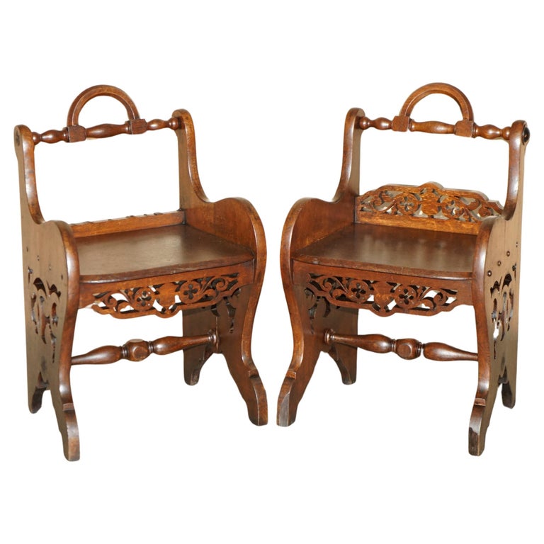 PAIR OF ANTIQUE VICTORIAN ENGLISH HAND CARVED HALL CHAIRS WITH ROTATING HANDLES