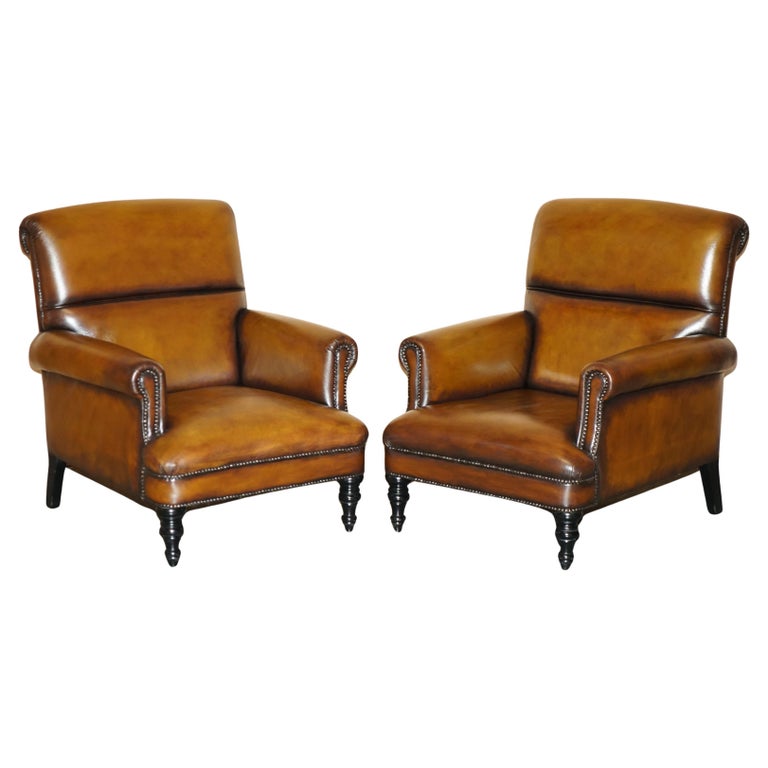 COMFORTABLE PAIR OF ROLLED BACK RESTORED CIGAR BROWN LEATHER CLUB ARMCHAIRS