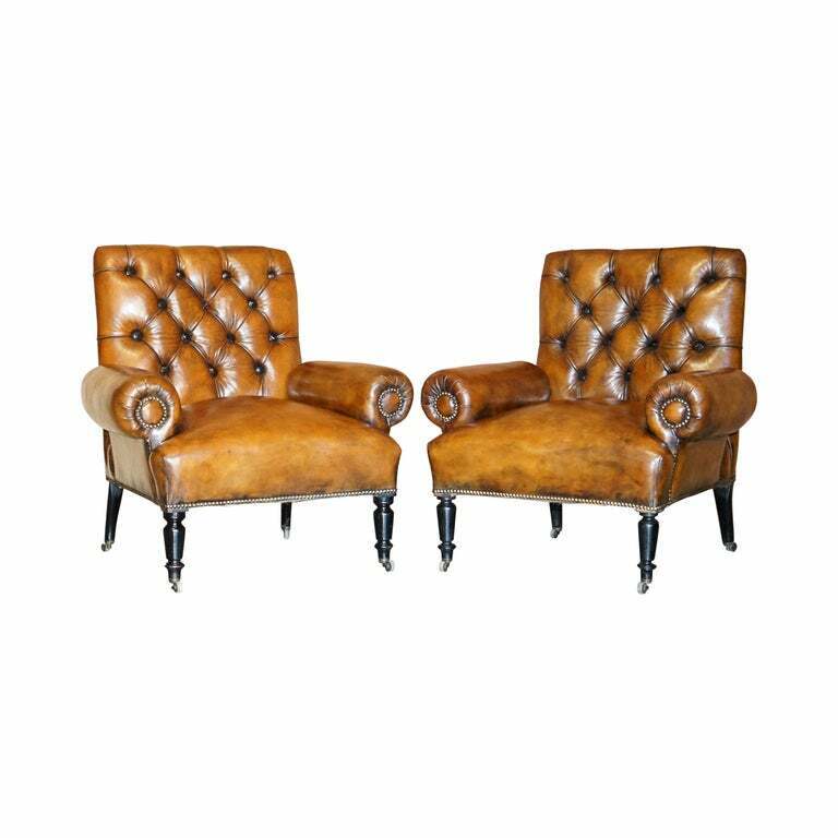 RESTORED PAIR OF ANTIQUE REGENCY BOLSTER ARM BROWN LEATHER LIBRARY ARMCHAIRS