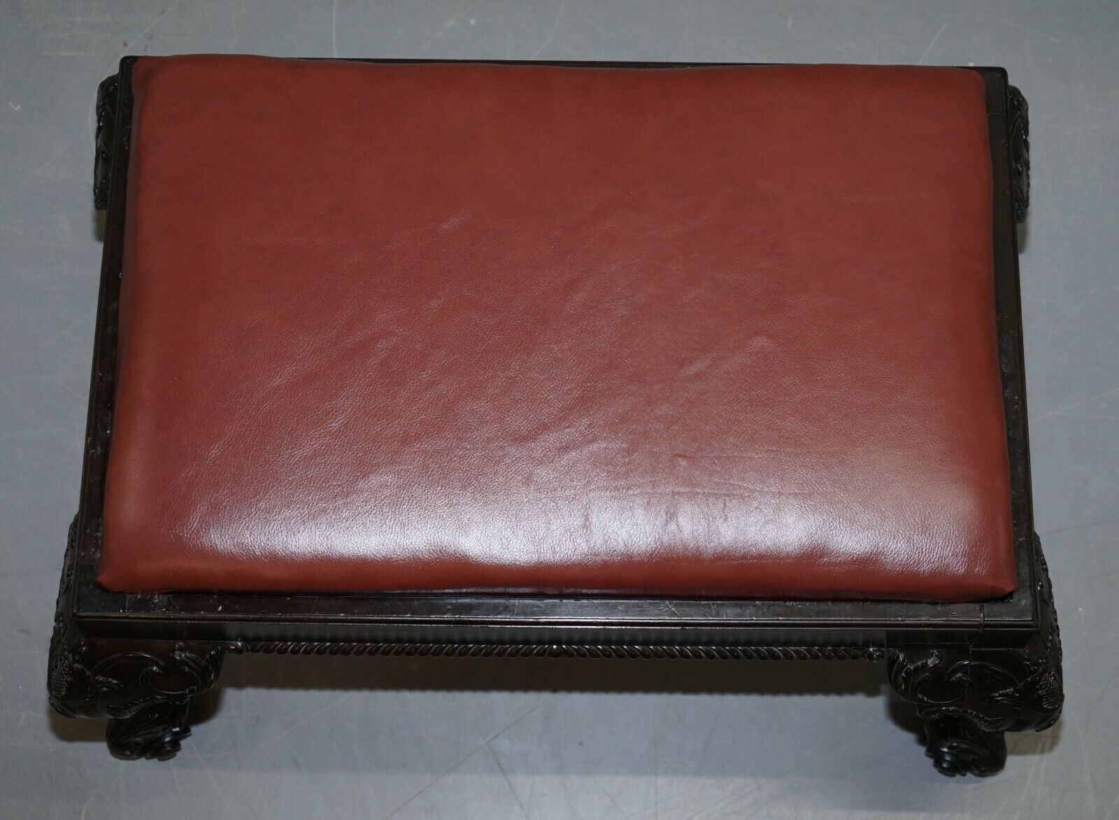 https://royalhouseantiques.co.uk/wp-content/uploads/imported/2/ANTIQUE-HAND-CARVED-ENGLISH-GEORGIAN-CLAW-BALL-FEET-FOOTSTOOL-BROWN-LEATHER-185372980372-4.jpg