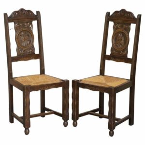 STUNNING PAIR OF ANTIQUE CIRCA 1920 RUSH SEAT HAND CARVED OAK BRITTANY CHAIRS