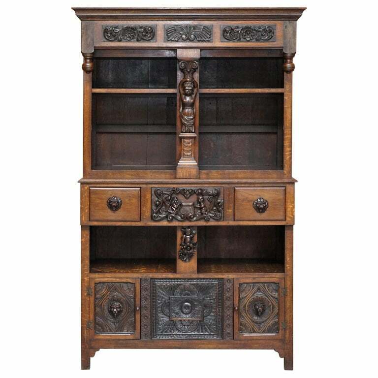 LARGE HEAVILY CARVED BOOKCASE CUPBOARD WITH ORNATE CHERUB PUTTI & LION FIGURES