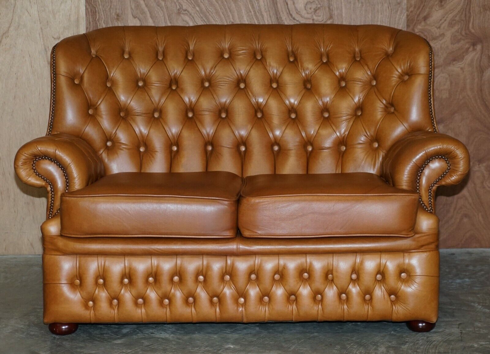 Small tufted store sofa