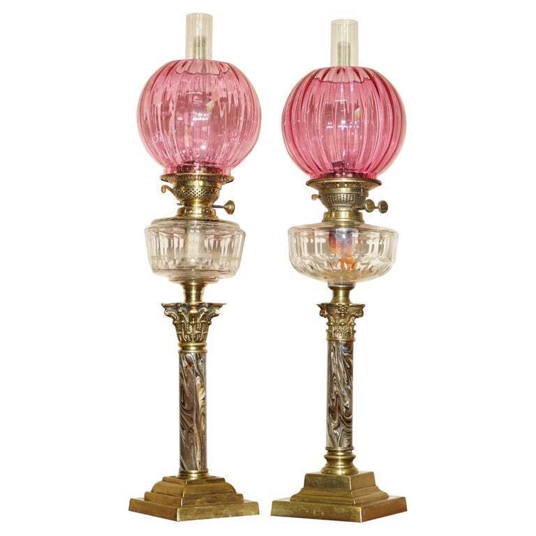 PAIR OF MARBLE FINISH CORINTHIAN PILLAR VICTORIAN OIL LAMPS ORIGINAL RUBY GLASS
