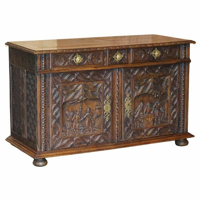 18TH CENTURY CIRCA 1740 HAND CARVED OAK SIDEBOARD WITH MILITARY CAMPAIGN SCENES