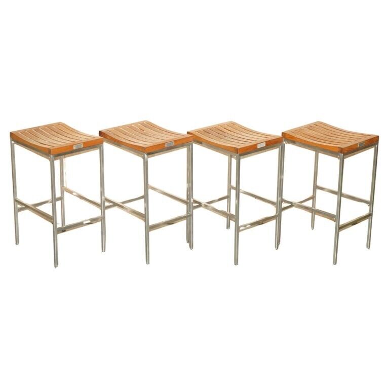 FINE SUITE OF FOUR INDIAN OCEAN METAL AND SLATTED WOOD BAR OR KITCHEN STOOLS