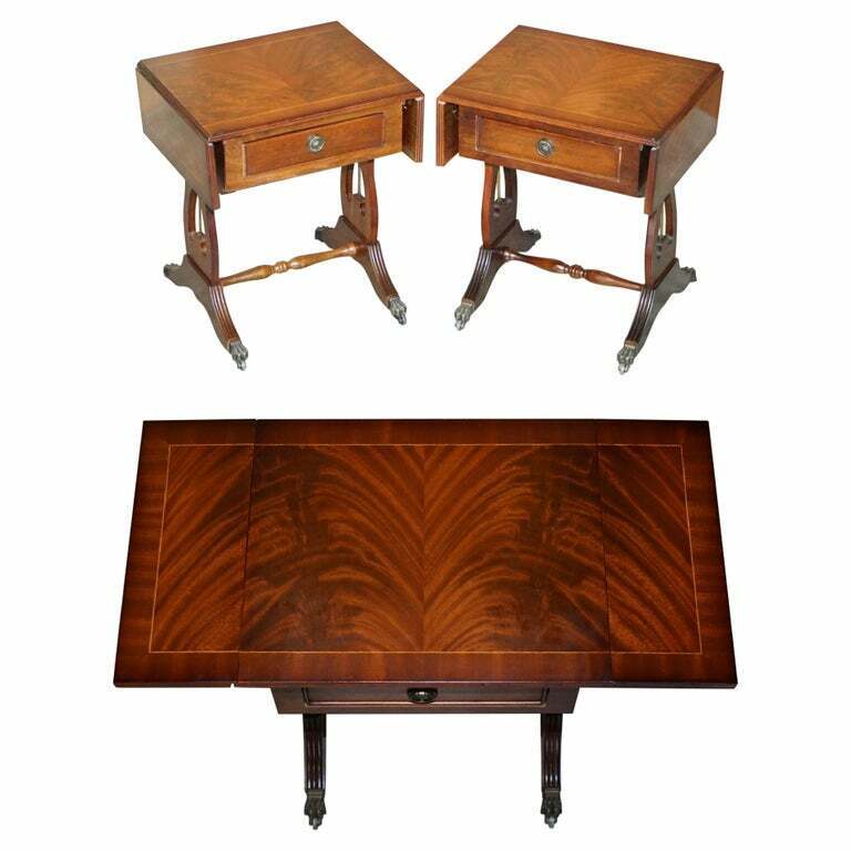 PAIR OF FLAMED MAHOGNAY EXTENDING SIDE END LAMP TABLES WITH LION PAW CASTORS