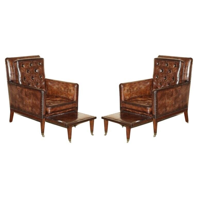 PAIR OF ANTIQUE REGENCY  BROWN LEATHER CHESTERFIELD ARMCHAIRS EXTENDING STOOLS